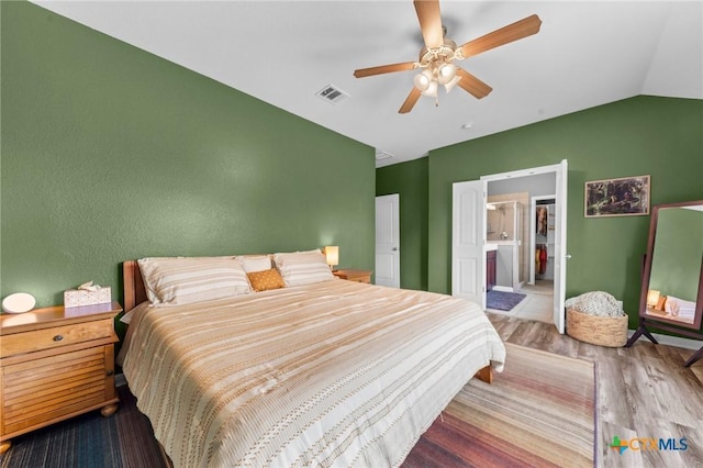 211 W Vega Ln, Killeen, TX 76542 - bedroom featuring vaulted ceiling, wood finished floors, a ceiling fan, and a textured wall