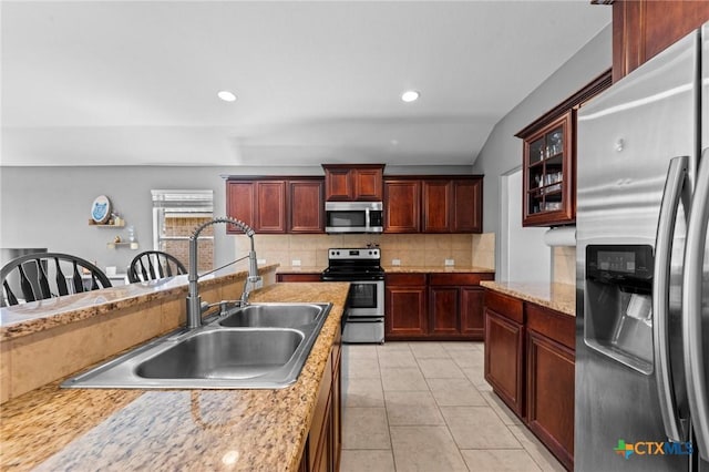 211 W Vega Ln, Killeen, TX 76542 - kitchen featuring stainless steel appliances, a sink, decorative backsplash, light countertops, and light tile patterned floors