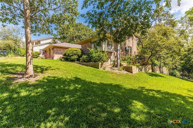 view of front of home with a front lawn