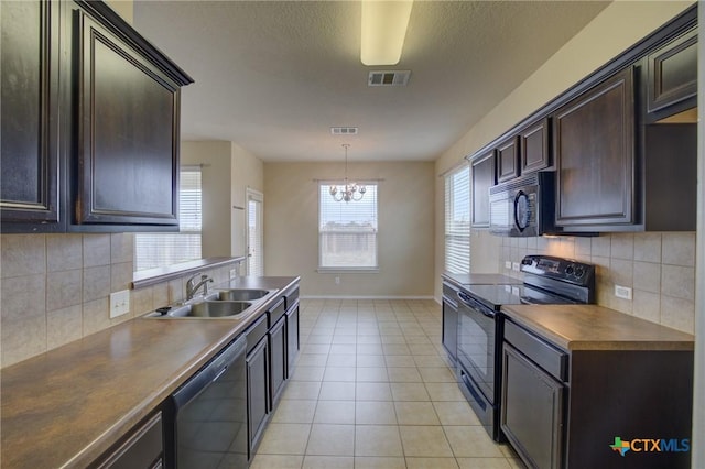 kitchen with tasteful backsplash, sink, black appliances, and an inviting chandelier