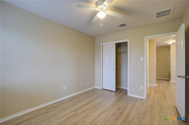 525 Tom Kemp Dr, New Braunfels, TX 78130 - unfurnished bedroom featuring light wood-style floors, a closet, and a ceiling fan