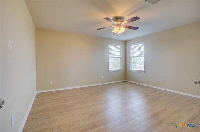 unfurnished room with ceiling fan and light wood-type flooring