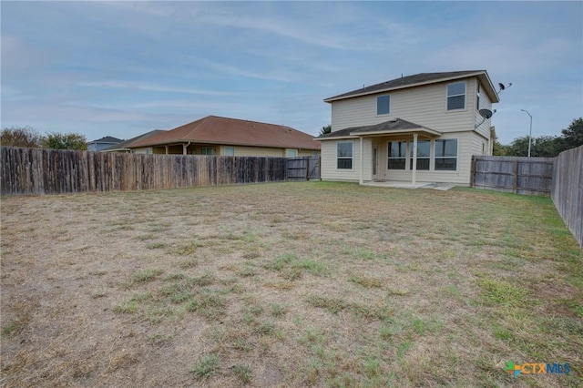 525 Tom Kemp Dr, New Braunfels, TX 78130 - rear view of house with a fenced backyard and a patio area