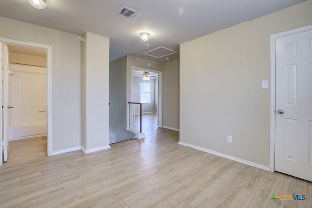 unfurnished room with light wood-type flooring