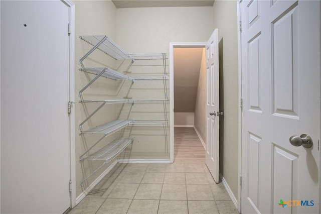 525 Tom Kemp Dr, New Braunfels, TX 78130 - spacious closet with light tile patterned flooring