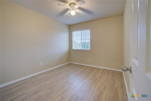 empty room featuring light hardwood / wood-style flooring and ceiling fan