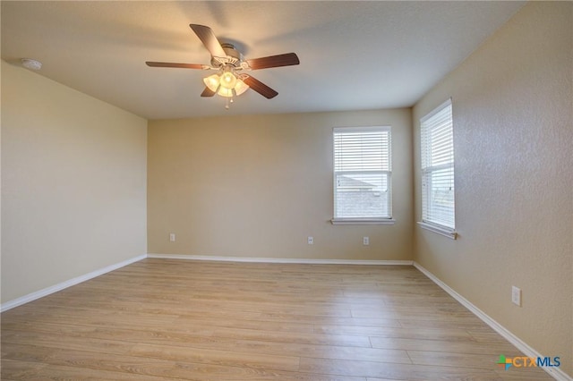 empty room with light hardwood / wood-style floors and ceiling fan