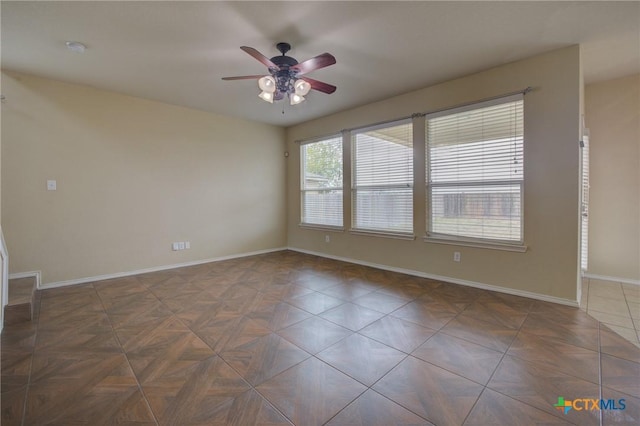 empty room featuring ceiling fan