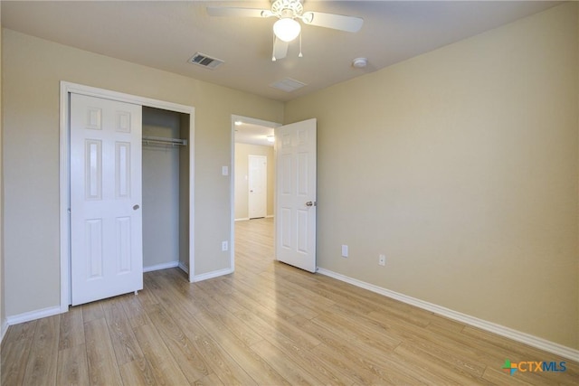 525 Tom Kemp Dr, New Braunfels, TX 78130 - unfurnished bedroom featuring a closet, ceiling fan, light wood finished floors, baseboards, and visible vents