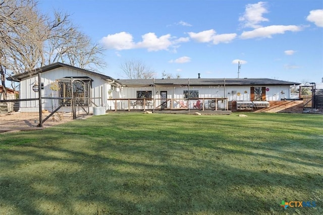 back of house featuring a yard