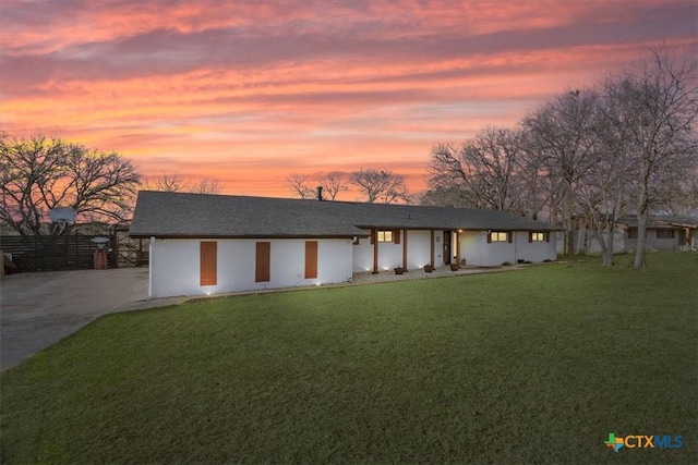 view of front of property with a yard