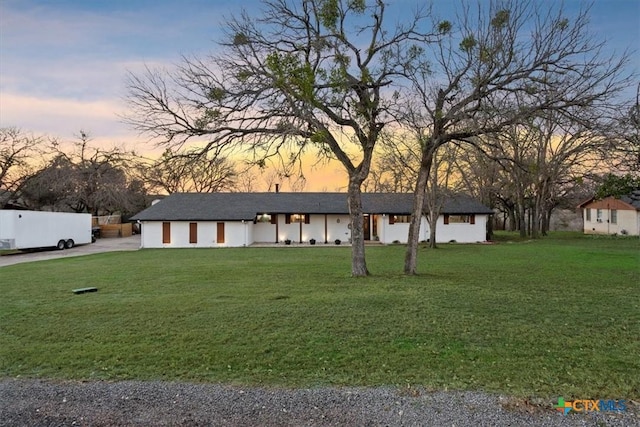 view of front of house with a lawn