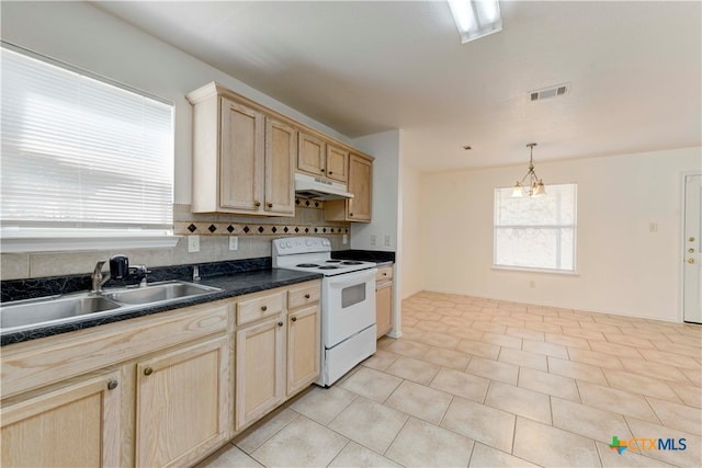 kitchen featuring pendant lighting, light brown cabinets, sink, electric range, and tasteful backsplash