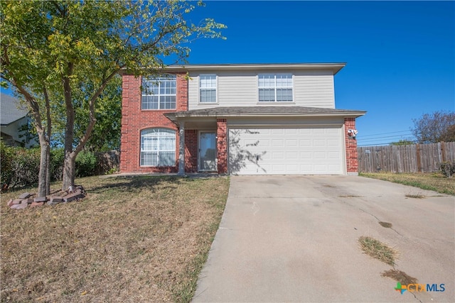 front facade featuring a front lawn and a garage