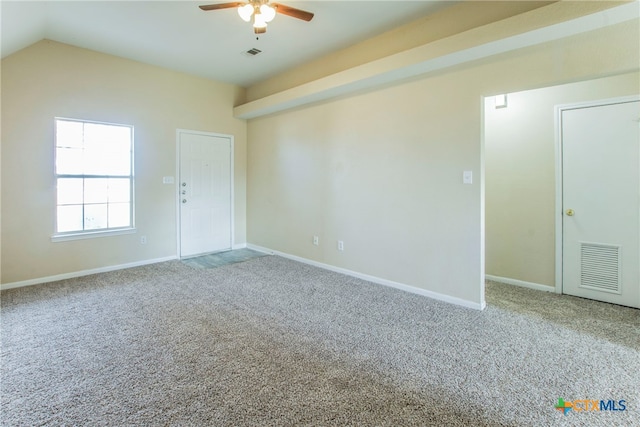 unfurnished room featuring lofted ceiling, ceiling fan, and carpet floors