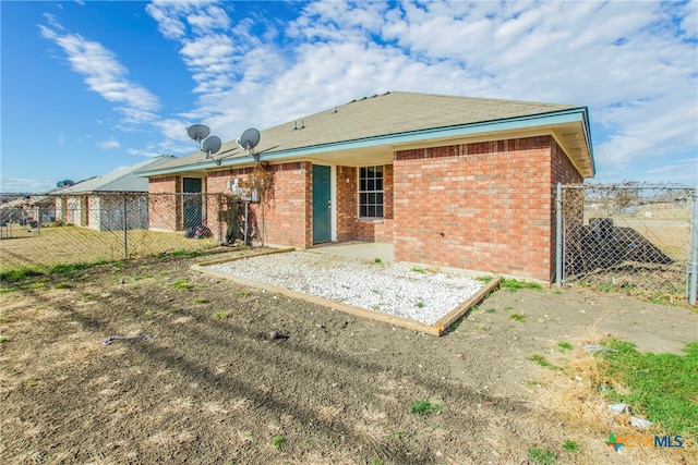 back of house with a patio