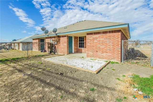 3504 Littleleaf Dr, Killeen, TX 76549 - back of property with brick siding, fence, and a patio