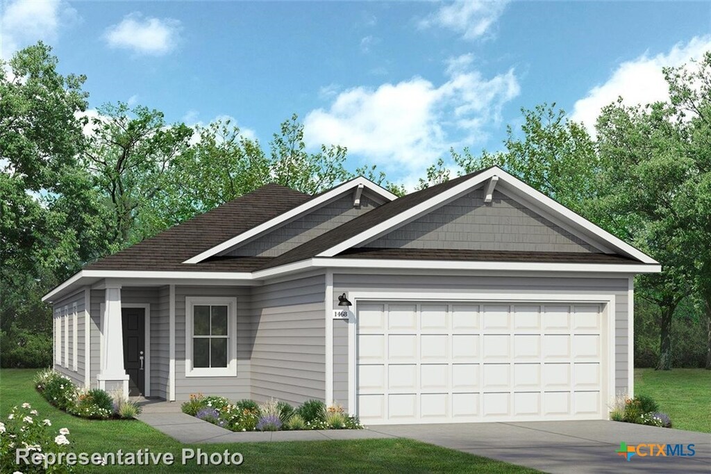 313 Haywood Mnr, Maxwell, TX 78656 - view of front of home with a garage, driveway, a front yard, and a shingled roof