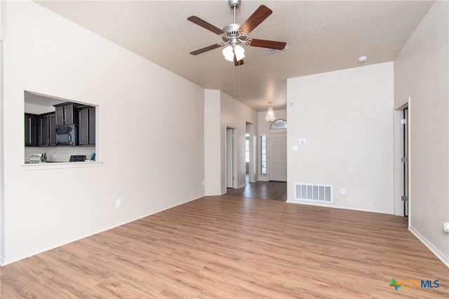 unfurnished living room with hardwood / wood-style floors and ceiling fan