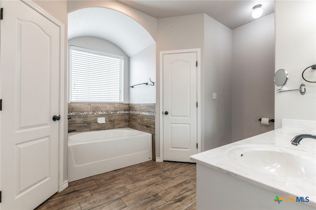 8530 Lamplight Ct, Temple, TX 76502 - full bath with a bath, wood finished floors, and vanity
