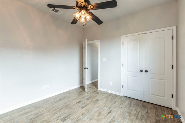 8530 Lamplight Ct, Temple, TX 76502 - unfurnished bedroom featuring light wood-style flooring, a closet, and a ceiling fan