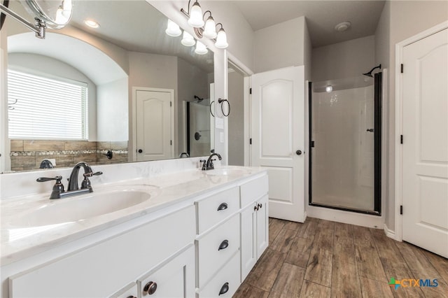8530 Lamplight Ct, Temple, TX 76502 - full bath featuring a stall shower, double vanity, and wood finished floors