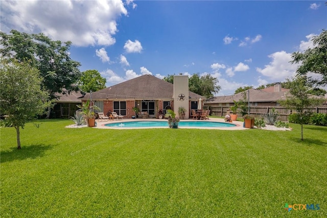 503 Ashland Crk, Victoria, TX 77901 - rear view of property with a chimney, a patio area, and brick siding