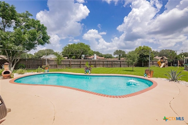 503 Ashland Crk, Victoria, TX 77901 - view of pool featuring a playground, a fenced backyard, and a patio area
