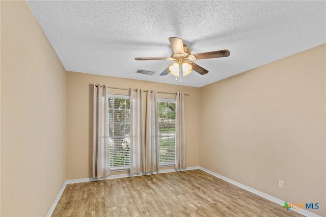 503 Ashland Crk, Victoria, TX 77901 - unfurnished room with wood finished floors, ceiling fan, and a textured ceiling