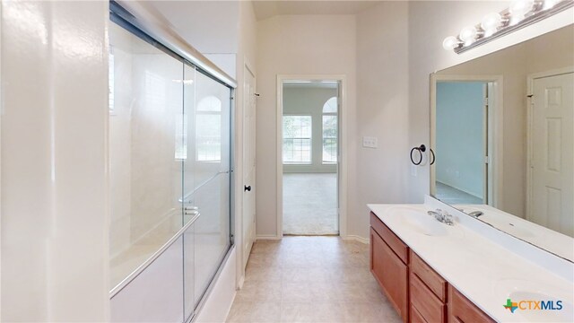 7016 Brandon Dr, Temple, TX 76502 - bathroom with double vanity, a shower with shower door, and tile patterned floors