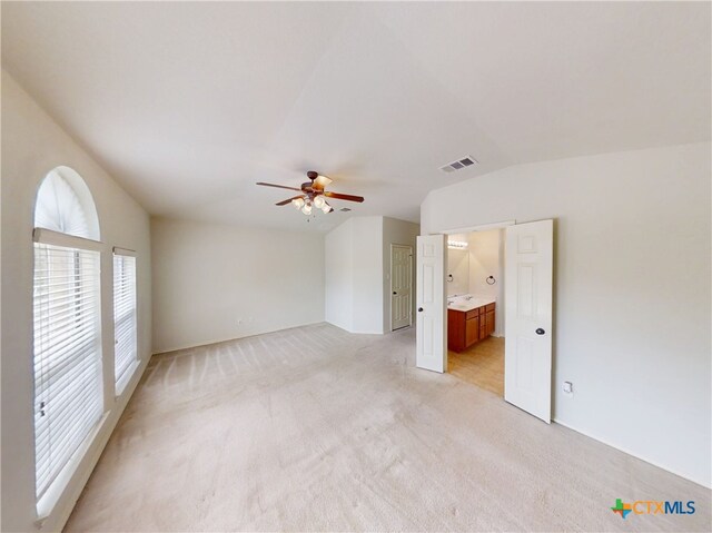 7016 Brandon Dr, Temple, TX 76502 - unfurnished room with vaulted ceiling, ceiling fan, and light colored carpet