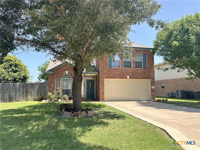 7016 Brandon Dr, Temple, TX 76502 - traditional-style house featuring brick siding, a garage, and driveway