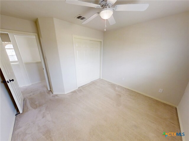 7016 Brandon Dr, Temple, TX 76502 - unfurnished bedroom with light carpet, ceiling fan, and a closet