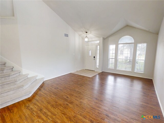 7016 Brandon Dr, Temple, TX 76502 - foyer with lofted ceiling, wood finished floors, and stairs