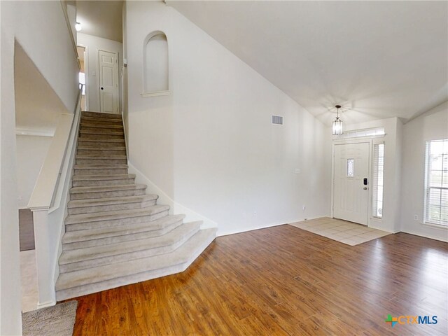 7016 Brandon Dr, Temple, TX 76502 - foyer entrance with wood finished floors, stairway, and lofted ceiling
