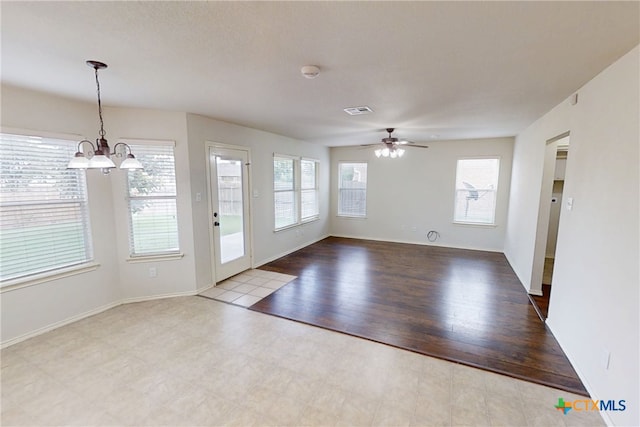 7016 Brandon Dr, Temple, TX 76502 - unfurnished living room featuring a chandelier and ceiling fan