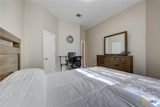 bedroom featuring visible vents