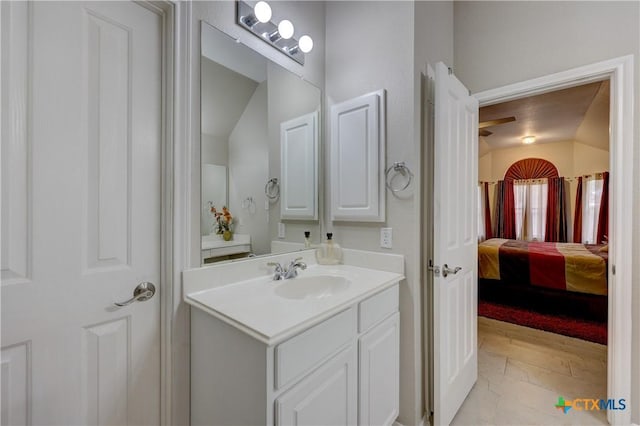 bathroom featuring ensuite bath and vanity