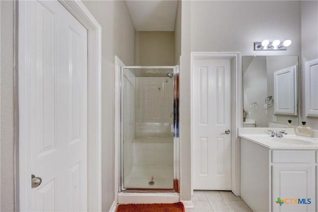 bathroom with vanity, tile patterned floors, and a stall shower