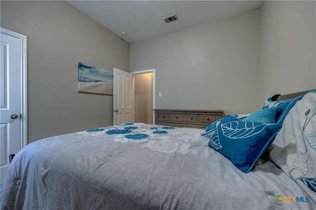 bedroom featuring visible vents