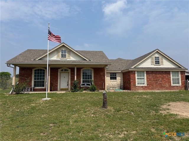 12169 Oakalla Rd, Killeen, TX 76549 - view of front facade featuring brick siding, a front yard, roof with shingles, and a porch