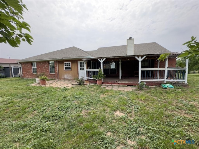 12169 Oakalla Rd, Killeen, TX 76549 - rear view of property featuring a chimney, a yard, a patio area, and brick siding