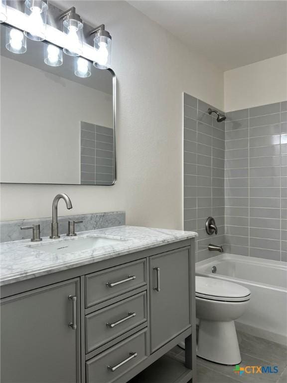 836 Mica Ln, Leander, TX 78641 - full bath featuring vanity, tile patterned flooring, toilet, and bathtub / shower combination