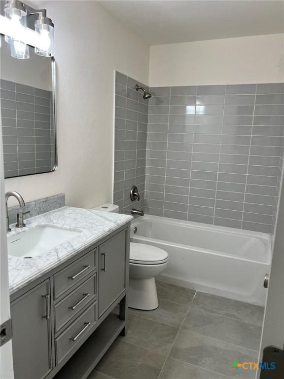 836 Mica Ln, Leander, TX 78641 - bathroom with vanity, washtub / shower combination, toilet, and tile patterned flooring