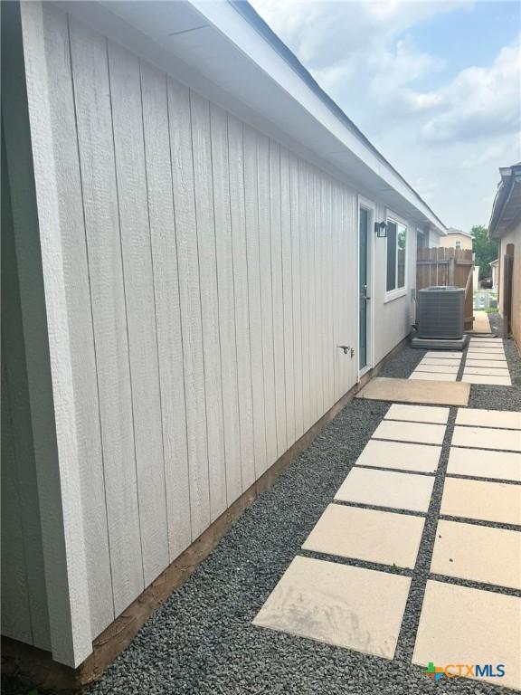 836 Mica Ln, Leander, TX 78641 - view of property exterior featuring central air condition unit and a patio
