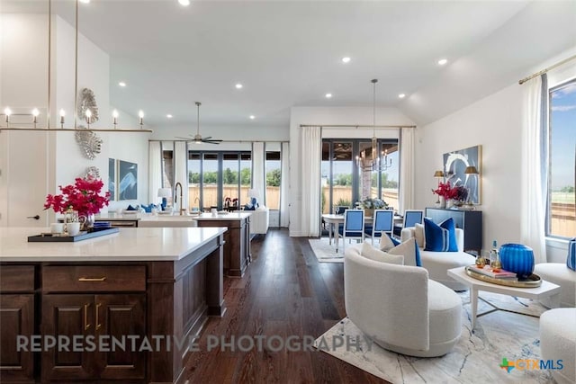 interior space featuring recessed lighting, lofted ceiling, dark wood finished floors, and ceiling fan