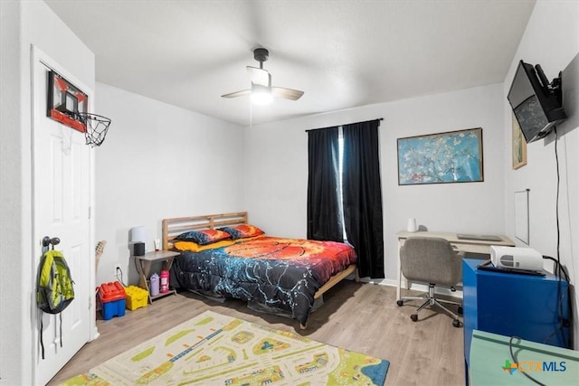 bedroom with ceiling fan and light hardwood / wood-style floors