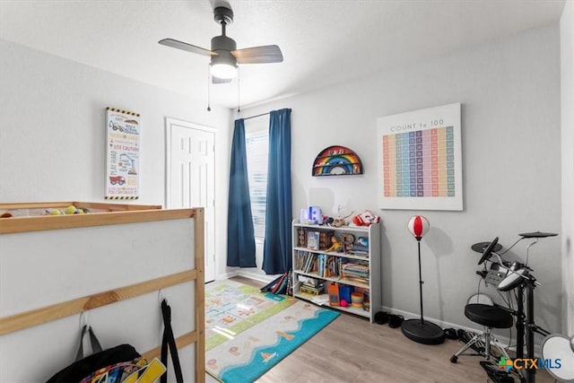 bedroom featuring light hardwood / wood-style flooring and ceiling fan