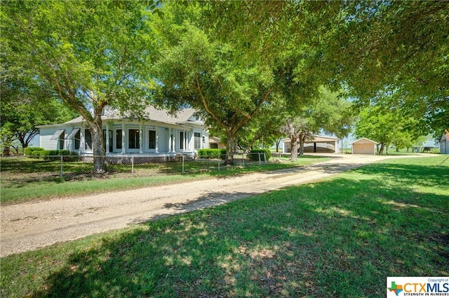 view of front of house featuring a garage and a front yard