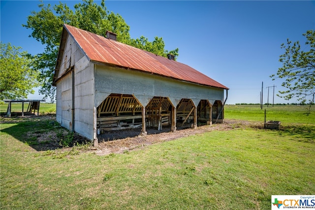 view of stable featuring a rural view